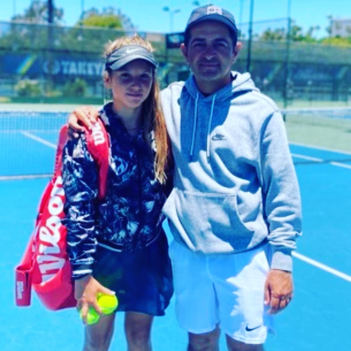Kristina Liutova on court with Sean Bollettieri